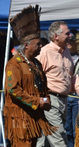 Chickahominy Chief Stephen Adkins escorts Virginia Governor Terry McAuliffe during grand entry.
