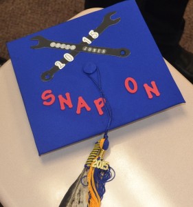 Colin Jones' mortarboard centers around his array of handy work.