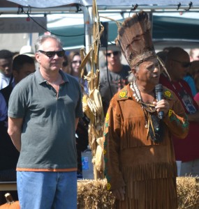Chickahominy Chief Stephen Adkins (right) is accompanied by Virginia Senator and Vice-Presidential candidate Tim Kaine (left) during the opening of the 65th annual powwow.