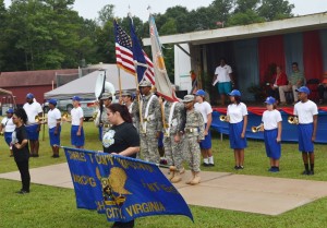Charles City’s JROTC and high school band stand solidified as one unit through the presentation of colors and performance to kick off the event.
