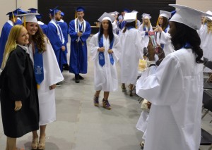 Kayla Davis (right) takes the role of photographer as she takes a picture of classmate Emily McCartney and instructor Deanna Tate.
