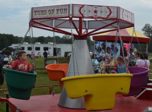 New rides were a part of Charles City County Fair’s midway, as kids were able to scrub their worries away in the swinging bathtubs. 