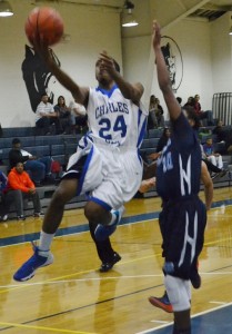 Panther guard Treyvon Cotman shields off Charger defender Brett Carter for his only score for the night.