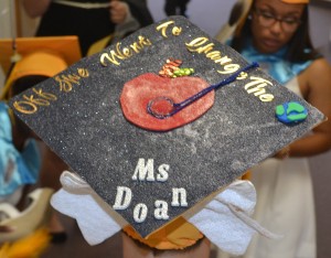Stephanie Doan's mortarboard depicts her future goals to impact the world as she journeys into the next phase of her life.