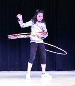 Madison Barnett wiggled her hips in circles as she manages four hula hoops at once, earning her runner-up accolades in the upper division.
