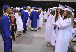 At left, Matthew Wiechman poses with English teacher Kari Rappold as Cat Perrine and Emily Montecalvo assume the role of photographers.