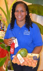 Tamika Hathaway presents a patriotic display of red, white, and blue ribbons on canned peaches, squash, and eggs,  en route to three-peating as the fair’s adult sweepstakes winner.
