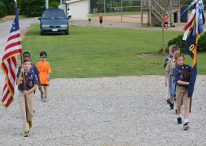 Boy scouts assemble to post the colors as part of the opening ceremonies.