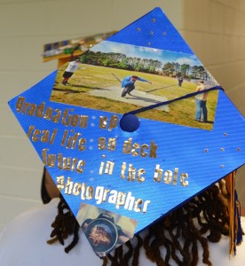 Track athlete Keith Williams' mortarboard signifies transitions from the athletic field to the real world.