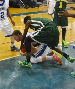 Panther senior forward Michael Grubbs cradles the ball to prevent a strip from a Northumberland defender.