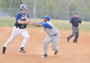 Charles City third baseman Andre' Mason applies a tag to Middlesex's Matthew Horne to get out of the third inning.