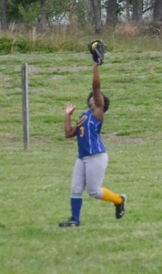 Lady Panther Mary Black stretches out her arm to pull down a line drive to left field in the fifth inning.