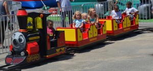 Kids take a ride on “Thomas the Train” as it takes to the track during Aug. 15 Saturday festivities at the county fair.