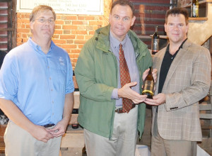 Carter family members (l to r) Randy and Charles Carter receive one of the first bottles of Shirley Chardonnay from Philip Carter Winery, as a gift to recognize the 400th anniversary of Shirley Plantation.