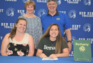 Alaina Torres inks her name as she will attend Bethany College to play volleyball.
