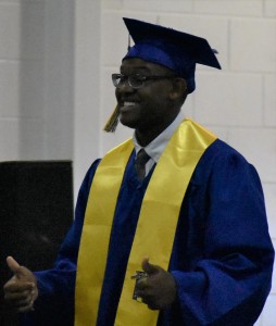 Dominic Davis gives two thumbs up after his name is called to receive his diploma.
