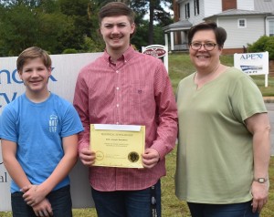 Cole Saunders (center) is accompanied by his brother Kyle (left) and mother Amy (right) as he receives the LaSertoma trade scholarship that is presented to a student who attends Bridging Communities Career and Technical School. The trade scholarship was presented through a matching donation from Snap-on Tools to assist Cole’s endeavors as he will continue his studies to become a diesel mechanic.