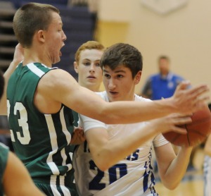 New Kent's Justin Cox pivots away from Jamestown's Michael Schmidt after being cut off in the lane.