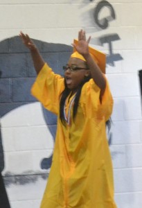 Miana Smith can’t contain her excitement as her name is called to receive her diploma.