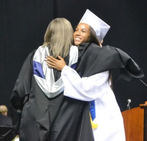 Sydney Griffith receives a big embrace from assistant principal Wendi James after hearing her name announced.