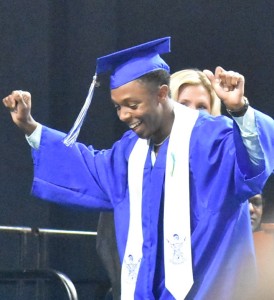 Dominique Akrie-Williams busts out a few moves as he makes his way across the stage.