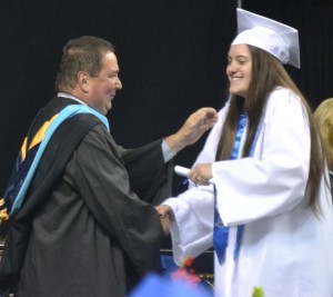 Kaylee Wright-Pierce doesn’t try to hide her excitement as she is congratulated by high school principal Chris Valdrighi after hearing her name.