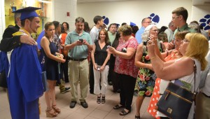 Old Dominion University bound Thomas Kelly smiles as more family members photograph the special occasion.