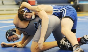 New Kent’s Kade Saunders attempts to turn Spring Valley’s Owen Porter. Saunders went on to win by pin at 170 pounds.