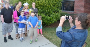Zoe Wallace has a sweet time with a candy bouquet and family in a photo to celebrate her accomplishments. 