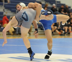 New Kent’s B.C. LaPrade takes down Spring Valley’s Jacob Ketcham en route to a pin at 145 pounds.
