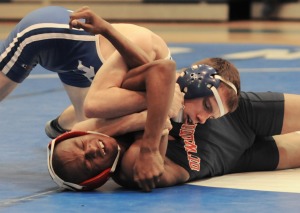 Bryson Mitchell has Dinwiddie’s Davion Prosise in trouble second before registering a pin.