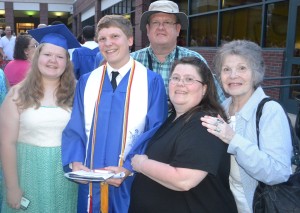 Former New Kent-Charles City Chronicle intern Ian Schwegal is surrounded by family in celebration for earning his high school diploma.