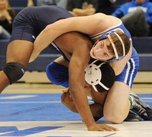 Brian Gray overcomes Dinwiddie’s Omar Tyson on the way to a pin.
