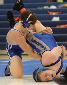 Kade Sanders gets York’s Dylan Bunch in a precarious position shortly before registering a pin for New Kent in the 160-pound match.