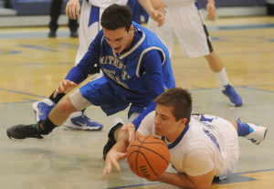 New Kent's Kevin Karaffa dives for a loose ball ahead of Smithfield's Steven Pullen.