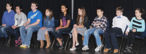 Grade group champions await the start of Friday's New Kent spelling bee. From left are NKMS seventh grader Noelle Kruger, NKES fifth grader Kendall Hicks, NKMS eighth grader Aiden Grant, Watkins third grader Morgan Schalasny, NKMS sixth grader Sophia Adkins, Watkins fourth grader Raina Niles, Watkins fifth grader Logan Hodge, NKES fourth grader Parker McBrayer, and NKES third grader Avah Petry.