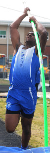 New Kent pole vaulter Darren Jones plants and heads skyward on the way to clearing 12 feet and placing second.
