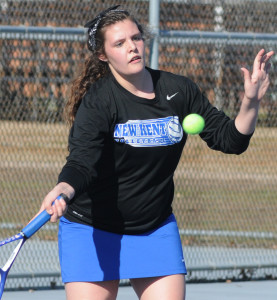 Brianne Wayman lofts a shot on the way to winning number 5 singles.