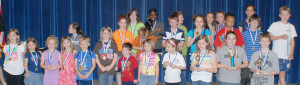 All winners and participants in grades 4-5 pose for a group photo. Categories and the top three in each are: Which paper towel is more absorbent? 1. Paige Hillis, 2. Kevin Woolard, 3. Annabelle Brame; What activity raises heart rate the most? 1. Cheyenne Smith, 2. Kylie Bowers, 3. Lauren Carlton; Which paper airplane style flies best or what food molds the fastest? 1. Sam Robinson, 2. Nekhita Kassey, 3. Dylan Rooks. K-3 entries were not judged.