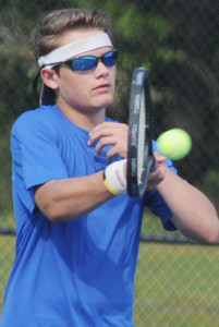 New Kent's Tate Estis drives a forehand shot back at his Colonial Heights' opponent.