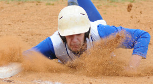  New Kent's Brennan Gray dives back to the bag at first to avoid being picked off.