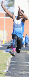 New Kent's R.J. Morris sails into the pit to finish fourth in long jump.