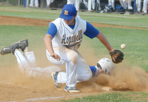 The ball gets away from Hopewell third baseman Will Avery as New Kent's Clay Simpson steals third.