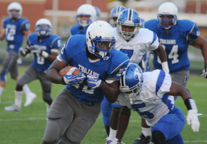 New Kent running back Mikel Chalmers looks for yardage after hauling in a first quarter Luke Mechling pass.