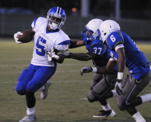 New Kent defenders Darren Jones (37) and T.J. Ward (6) track down York running back Devin Campbell.