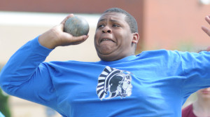 New Kent's Josh Dixon launches the shot. His best throw missed placing in the top six by four inches.