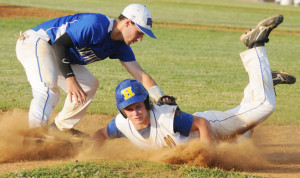 New Kent third baseman Quentin Schaffer tags Hopewell's Travis Hogan on a pickoff attempt at third, but Hogan beat the tag.