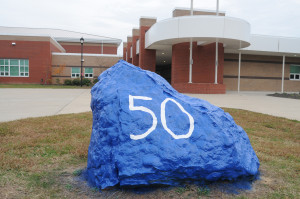 Above is the “Victory Rock” outside New Kent High School bearing Vick’s number 50. Below is a close-up of one of the many hallway banners covered with messages from students.
