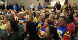 An overflow crowd, many of them avid bicyclists, packed the county government building's boardroom for the ribbon-cutting ceremony.