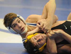 New Kent's Blake Hohman looks to the ref as he closes in on pinning his King William opponent.